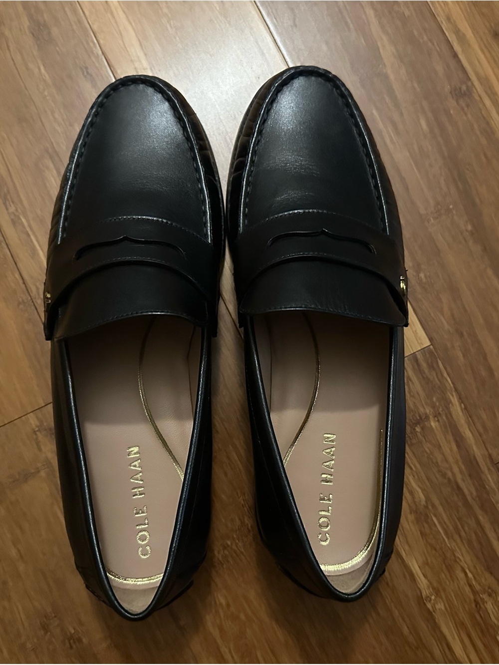 Cole Haan Black Leather Penny Loafers with Gold Branding